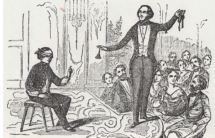 Imagen 2. Jean Eugène Robert-Houdin (1805-1871) presentando la Lectura a Ciegas frente al público parisino.